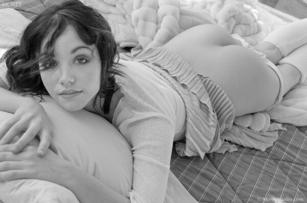 Semi nude model, Christelle, on bed in Oakland studio, b&w photo © Craig Morey 2007