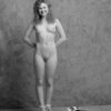 nude model Priska, standing and smiling, b&w photo